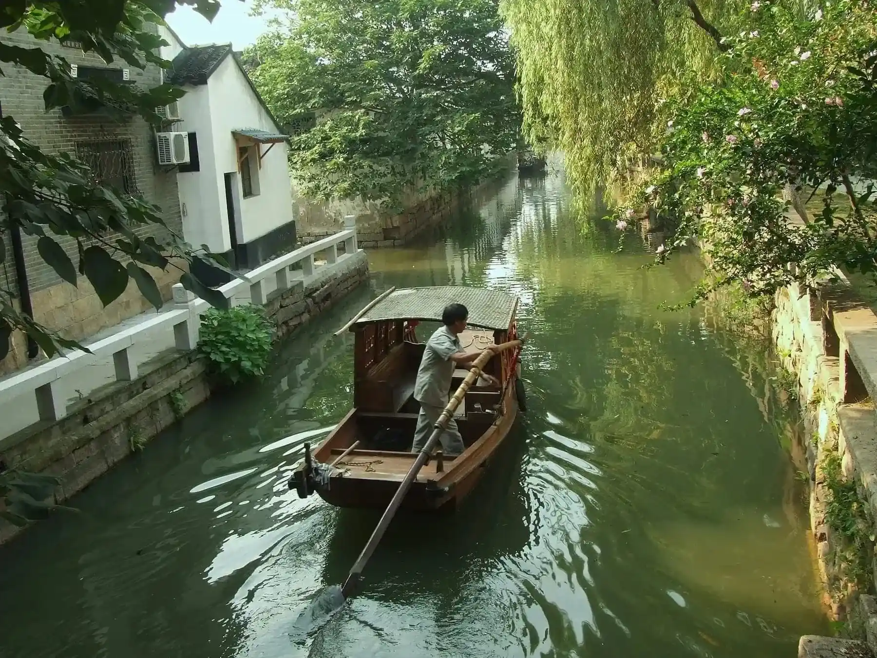 Suzhou canal boats and Pingjiang Road at dusk